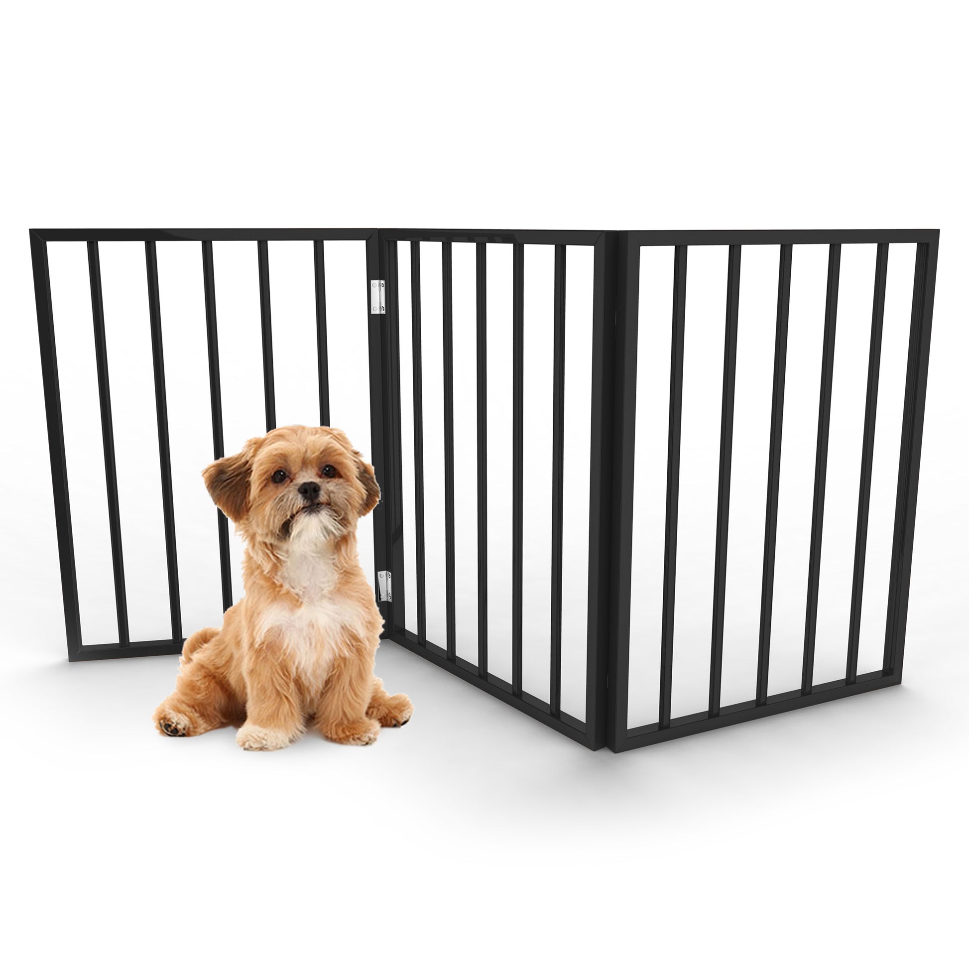 Puppy dog sits obediently in front of 3-panel dog gate